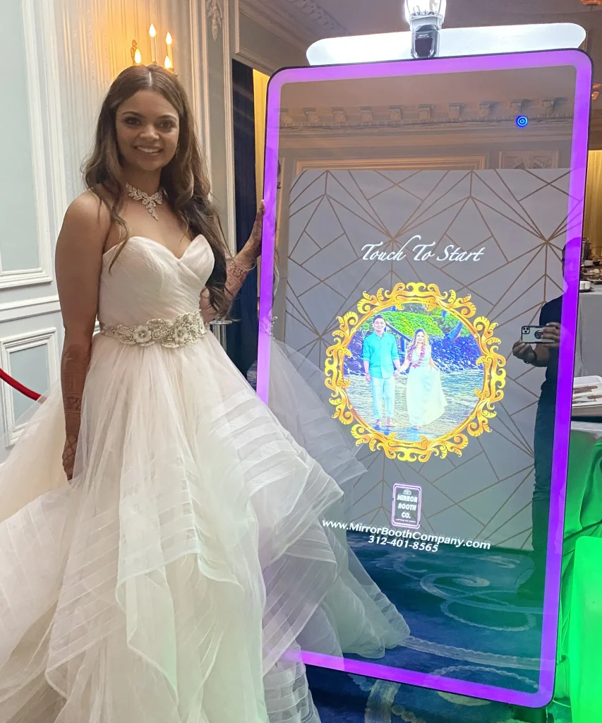 bride standing in front of custom welcome screen on magic mirror
